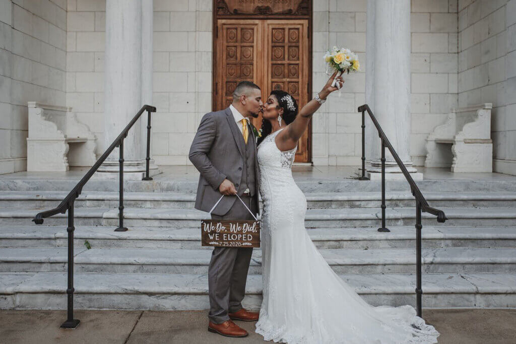 A couple celebrates in front of the Brooks Museum in Memphis after eloping on the marble steps, shot by Wandering Creative, Memphis Elopement Photographer