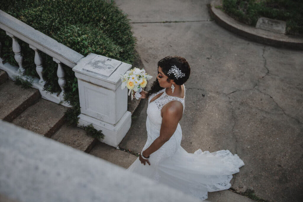 Bride walking up the steps to meet her groom in their memphis elopement, at the Brooks Museum
