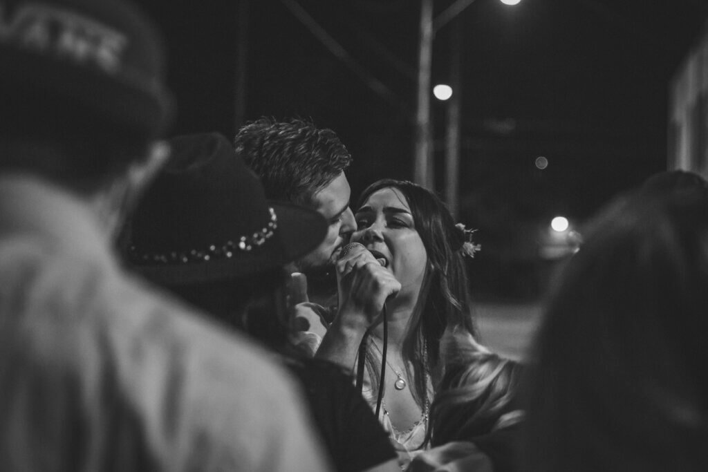Couple sings together during their reception at the HiTone, shot by Memphis photographer Wandering Creative.