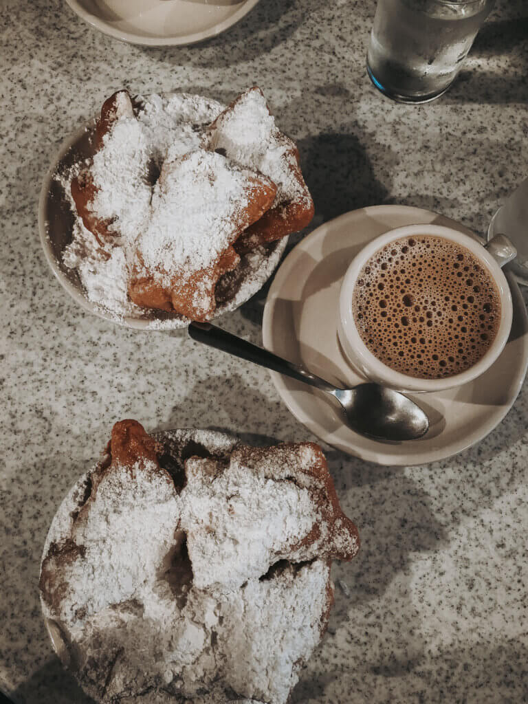 Beignets and coffee at Cafe DuMonde in New Orleans.
