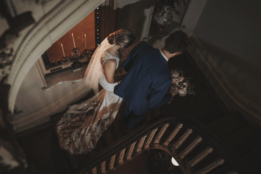 bridal portrait of couple walking up the stairs at the Woodruff Fontaine House in Memphis, TN.