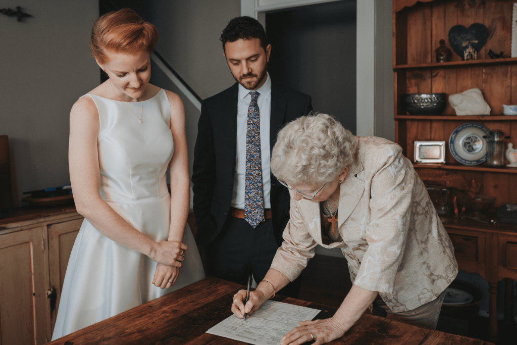 signing the marriage license at an intimate elopement in memphis, tn.