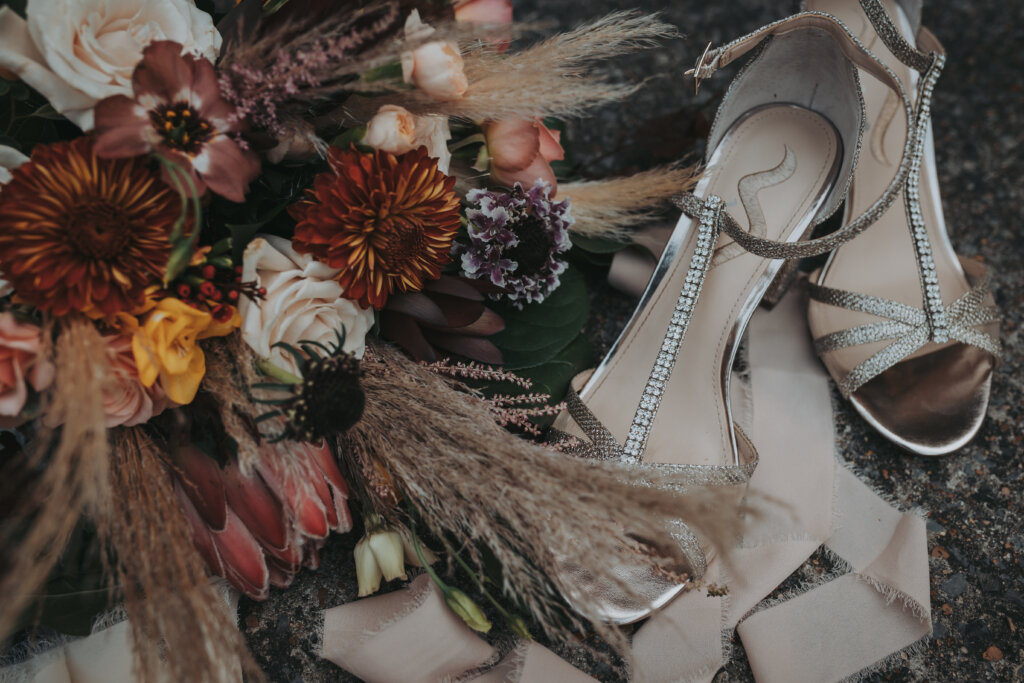 a photo of bride's shoes and bouquet at Memphis Botanic Garden. Shot by wandering creative