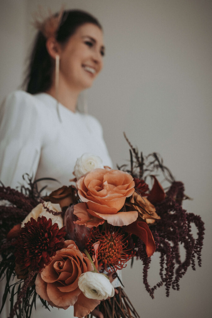beautiful bouquet held by smiling bride