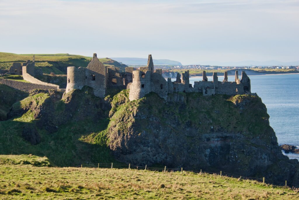 dunluce castle in ireland, right on the water and perfect for an ireland destination wedding. Photo by H Hach.