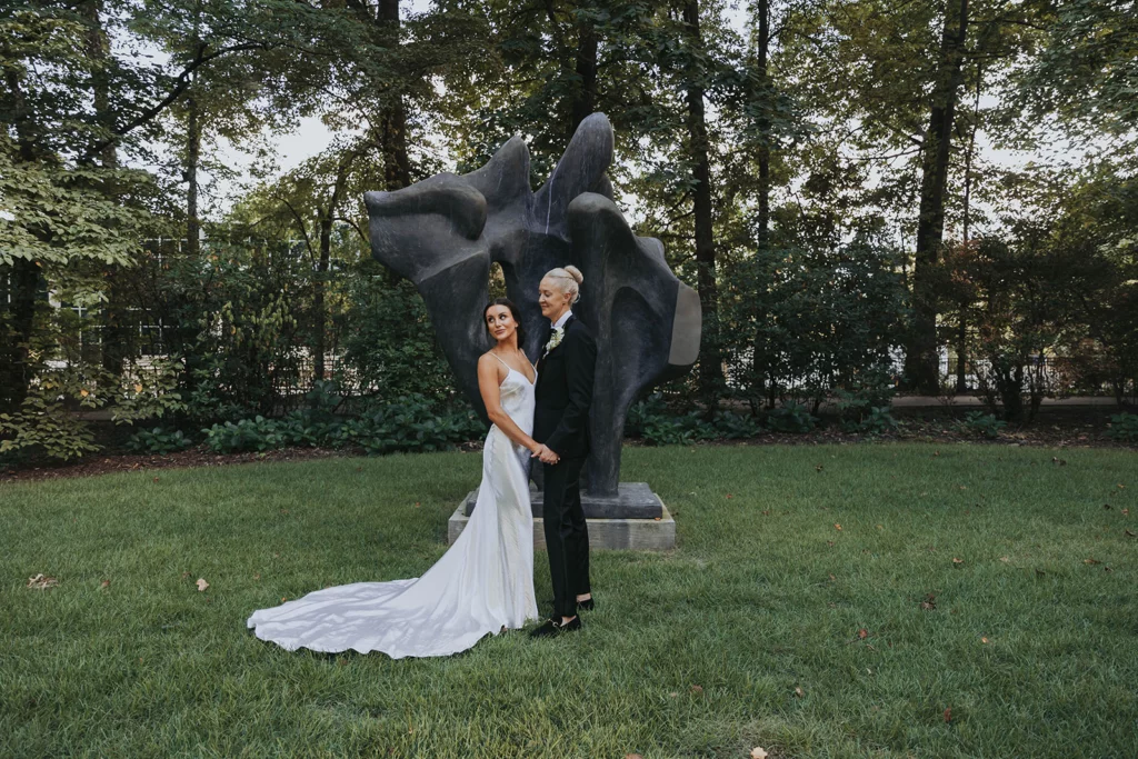 Newlywed portrait at the sculpture in the Hughes Pavilion garden area at the Dixon gallery and gardens in Memphis.