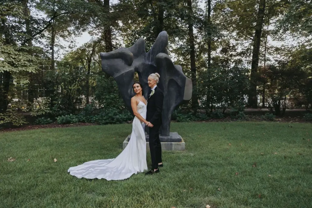 A bride and her partner pose in Memphis' Dixon Gardens.