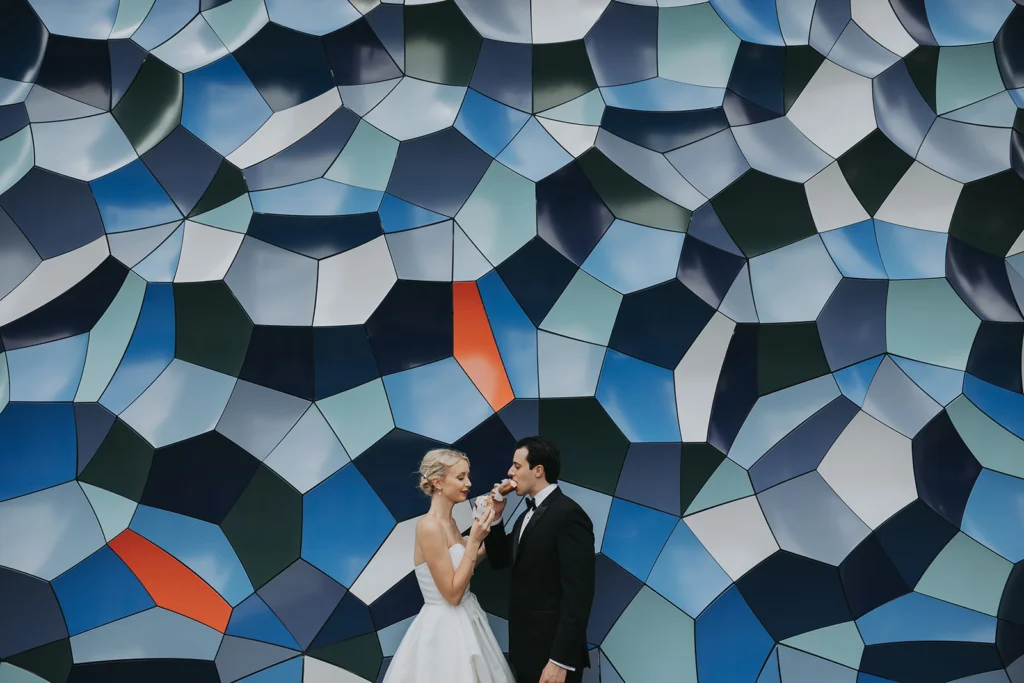 A bride and groom enjoy donuts from Do Rite Donuts in downtown Chicago.